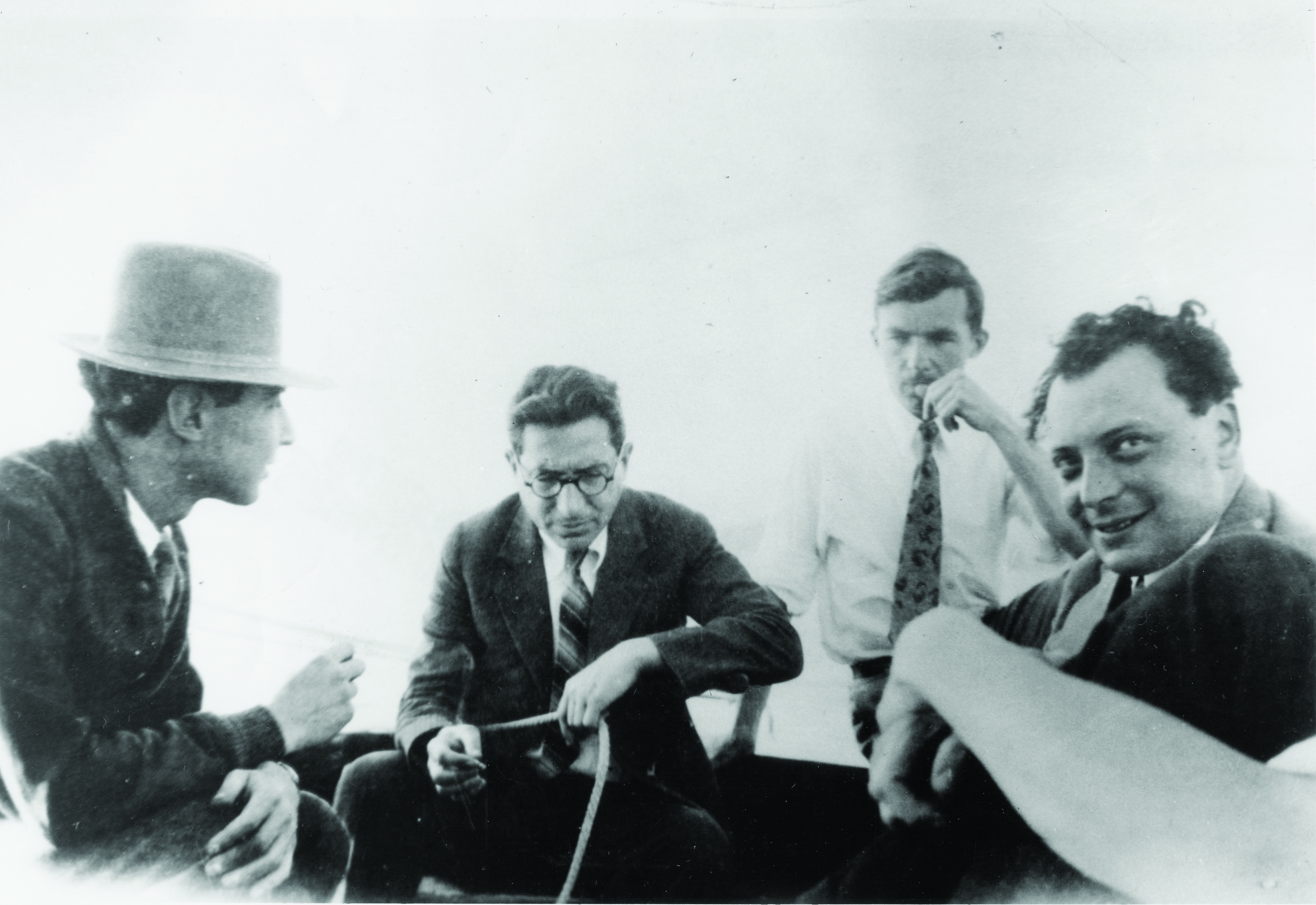 Four men sitting in a boat.