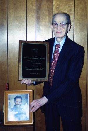 Donald Edwards with a picture of Ron McNair.