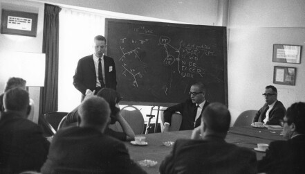 Steven Weinberg at blackboard