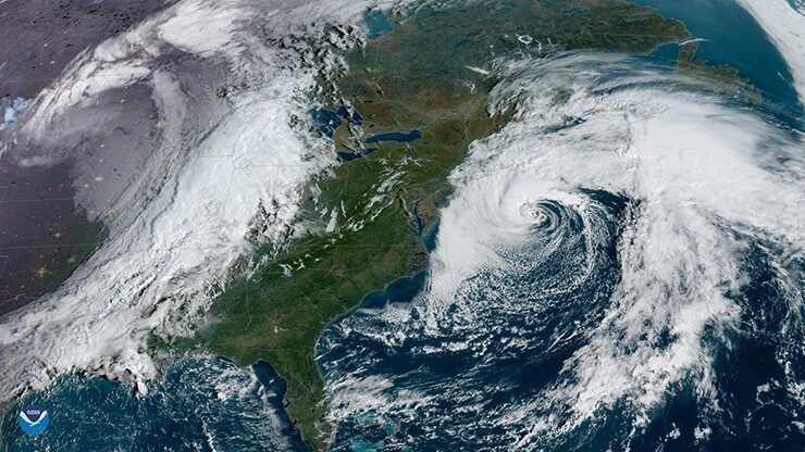 An image of two large storm systems over North America on Oct. 11 from the GOES East geostationary satellite.