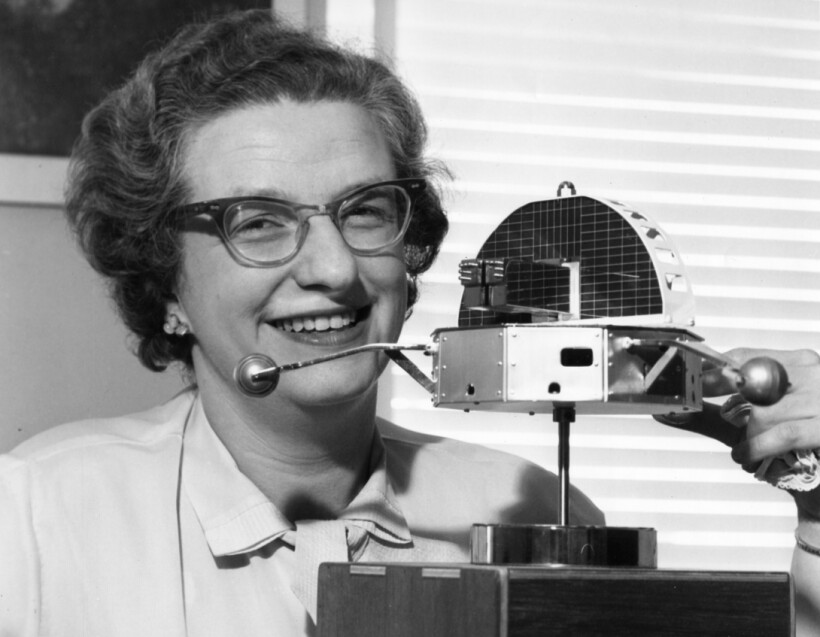Nancy Roman holding a model of OSO