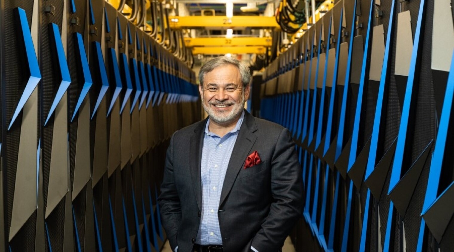 Deputy Energy Secretary Dan Brouillette poses with the Summit supercomputer during a visit to Oak Ridge National Lab in August.