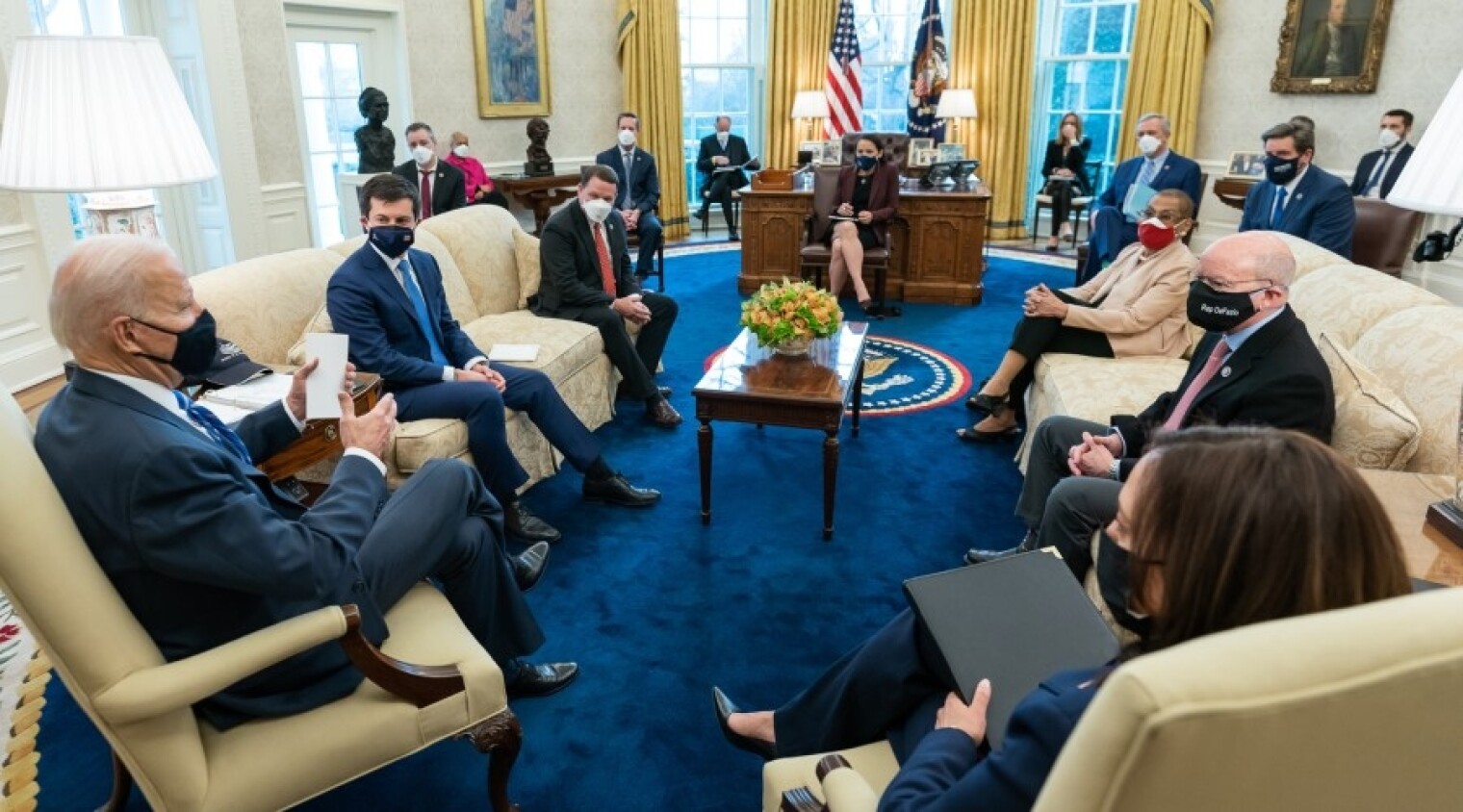 President Biden meets with lawmakers at a March meeting on infrastructure priorities.