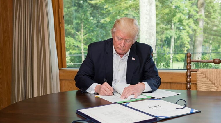 On Friday evening, President Trump signed a legislative package extending federal agency spending and the debt ceiling through Dec. 8, and providing emergency spending on disaster relief for recent hurricanes and wildfires. (Image credit – White House)