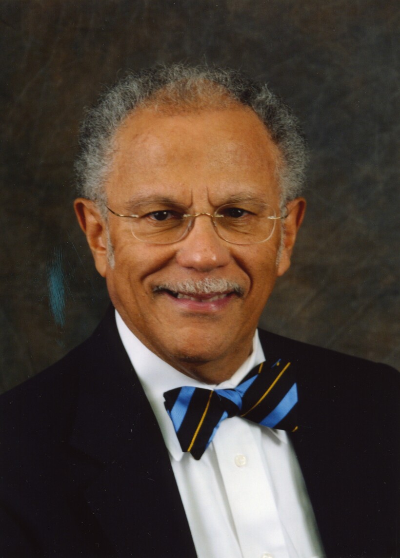 Formal portrait in color of a man with a bow tie.