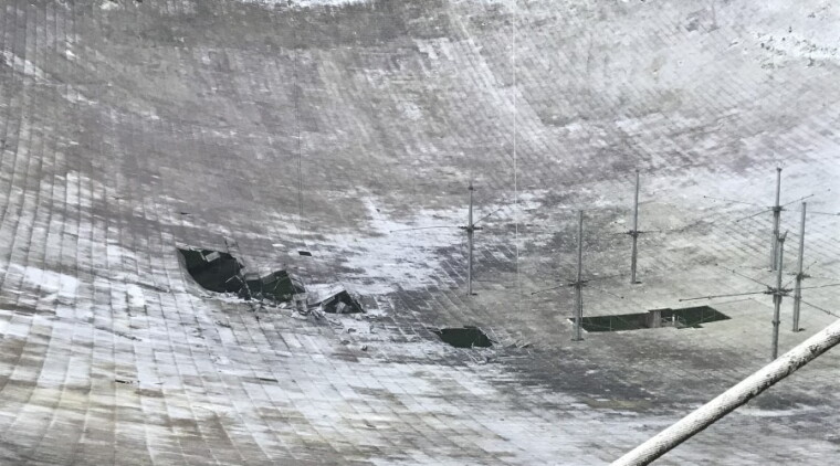 A broken cable damaged about 250 aluminum panels in the primary radio reflector dish of the Arecibo Observatory in Puerto Rico.