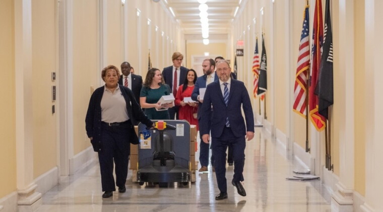 Staff from the Government Publishing Office wheel copies of the president’s budget request to congressional offices in 2020.