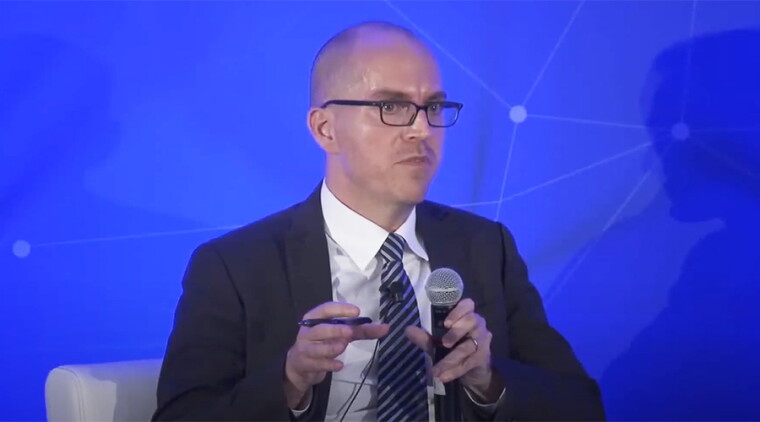 Jason Matheny speaks at a 2019 conference of the National Security Commission on Artificial Intelligence.