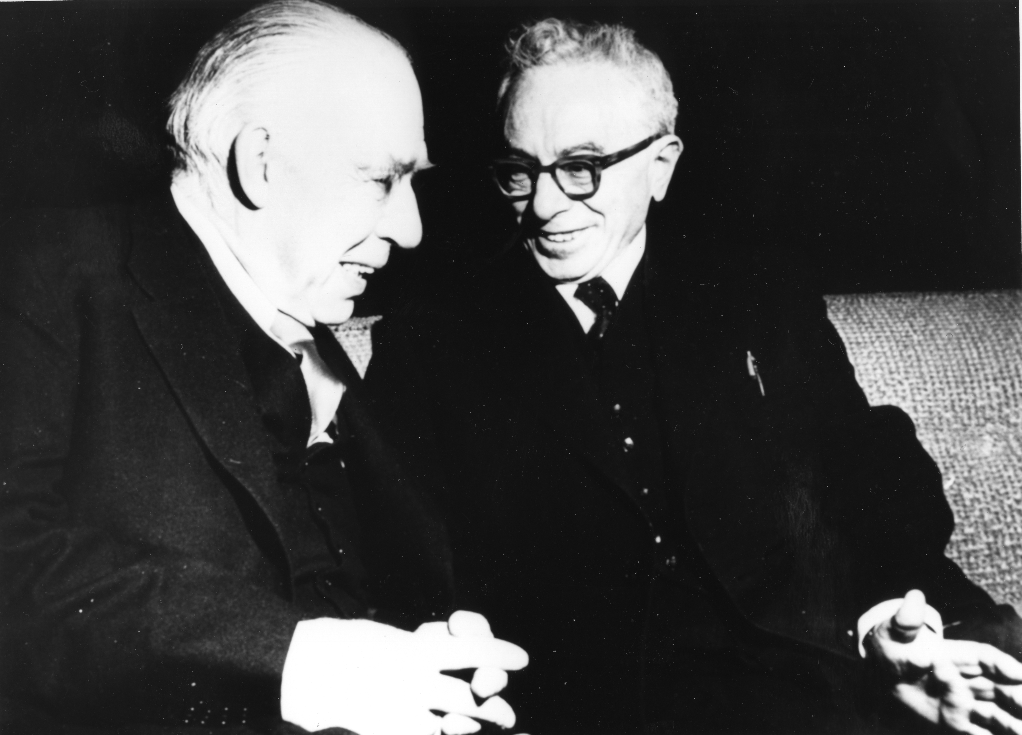 Two men seated together.