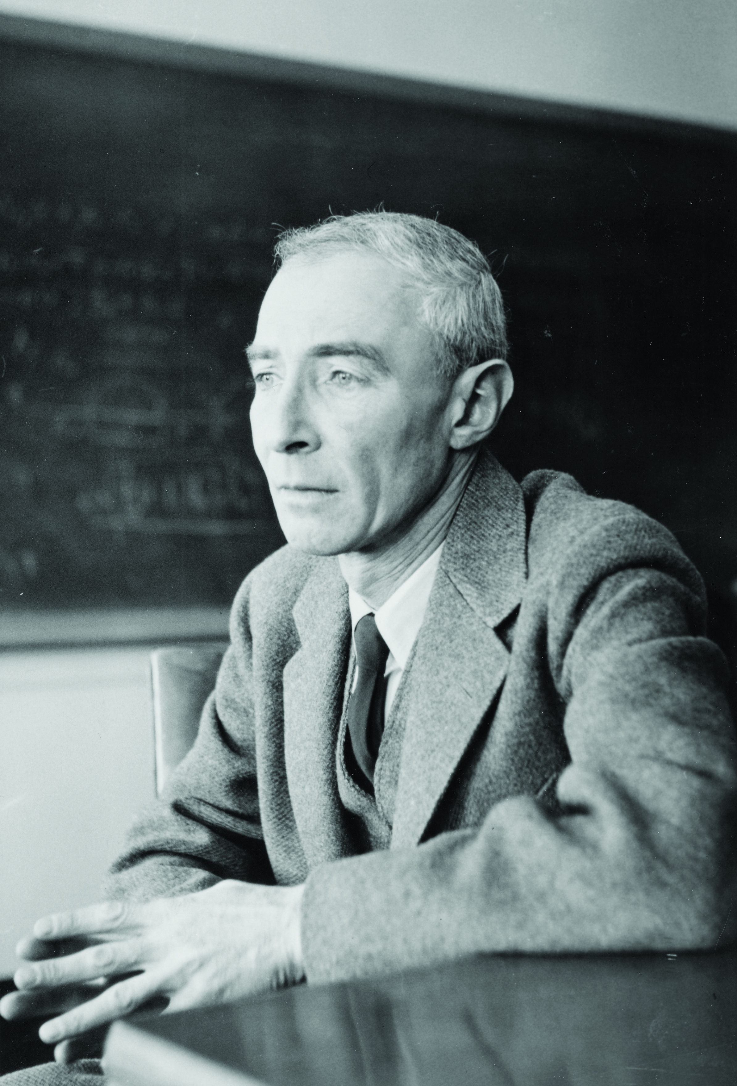 An older man stares pensively.